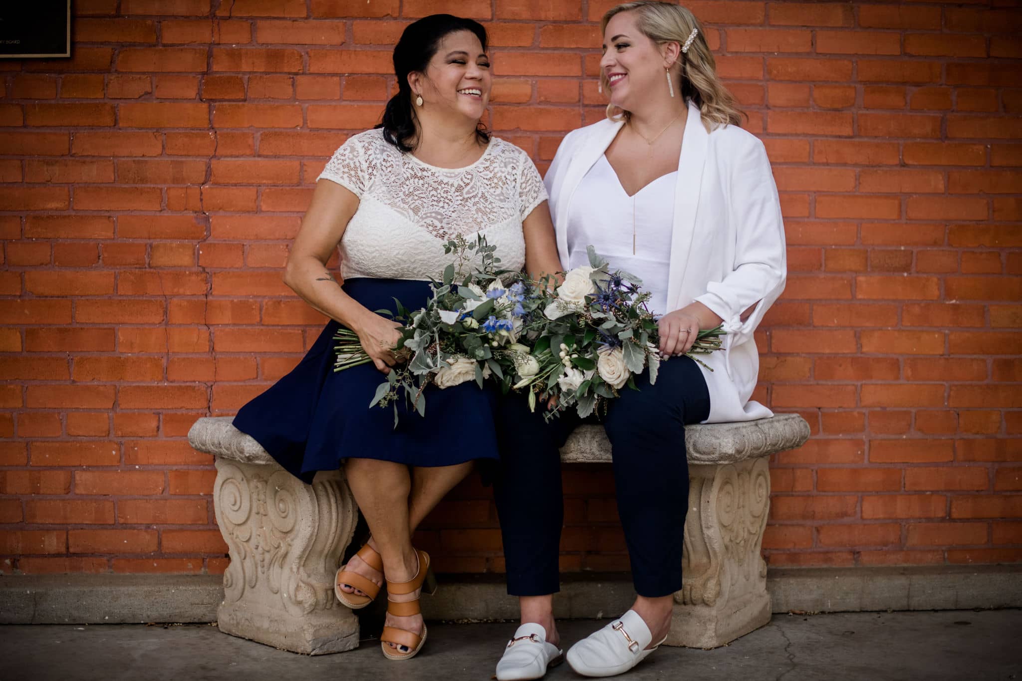 the texas brides share a moment together after eloping at brazos county courthouse