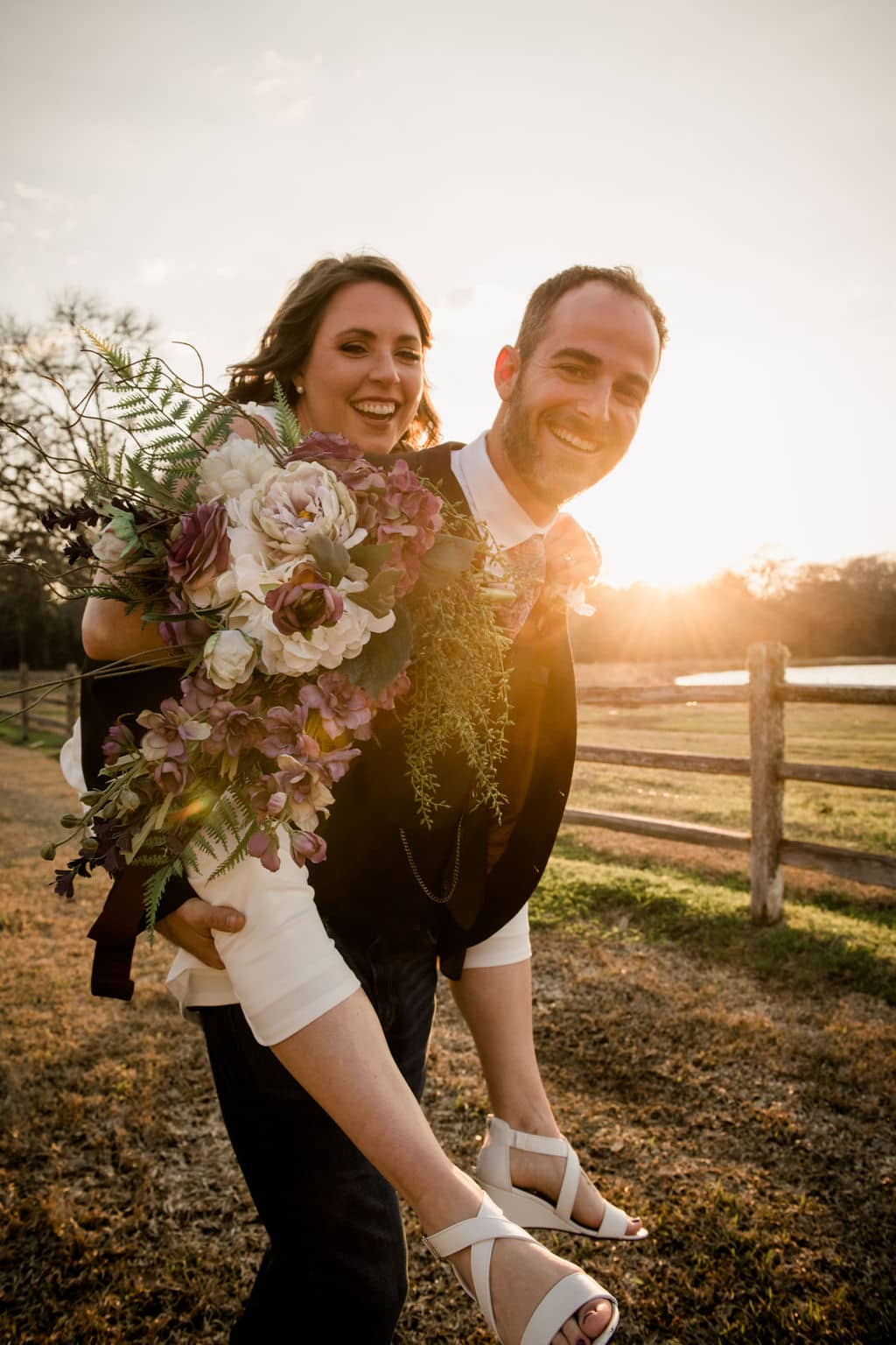 the texas bride and groom pose for photos after their airbnb elopement as a piggyback ride
