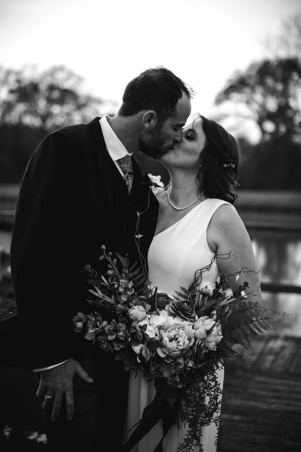 the texas bride and groom share a kiss as newlyweds