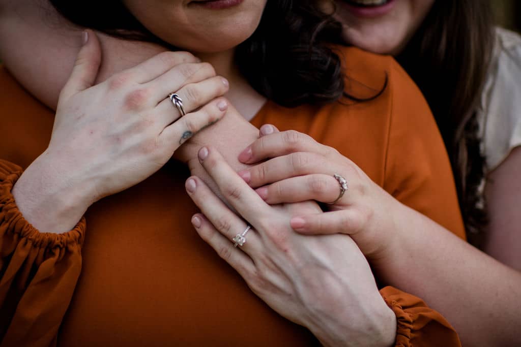 two brides holding hands at a bryan-college station wedding venue in an inclusive client experience