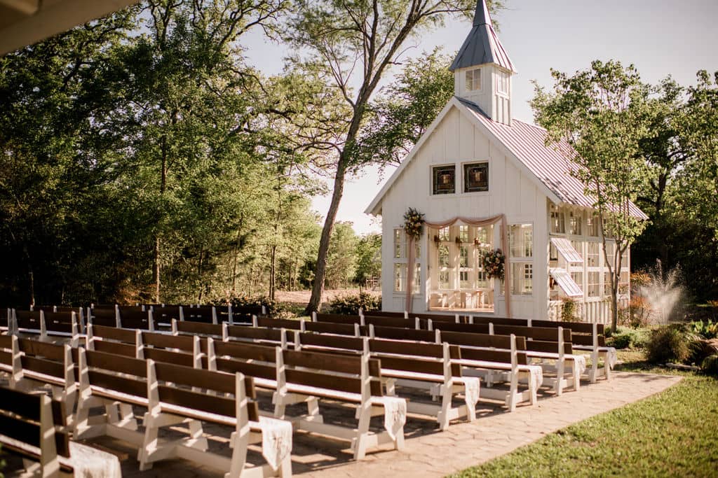 the popular white chapel of 7F Lodge and Events in College Station, texas