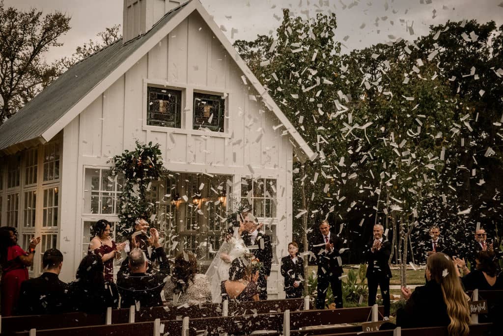 7F Lodge in Texas surrounded by confetti as a unique wedding exit captured by Jamie Hardin Photography