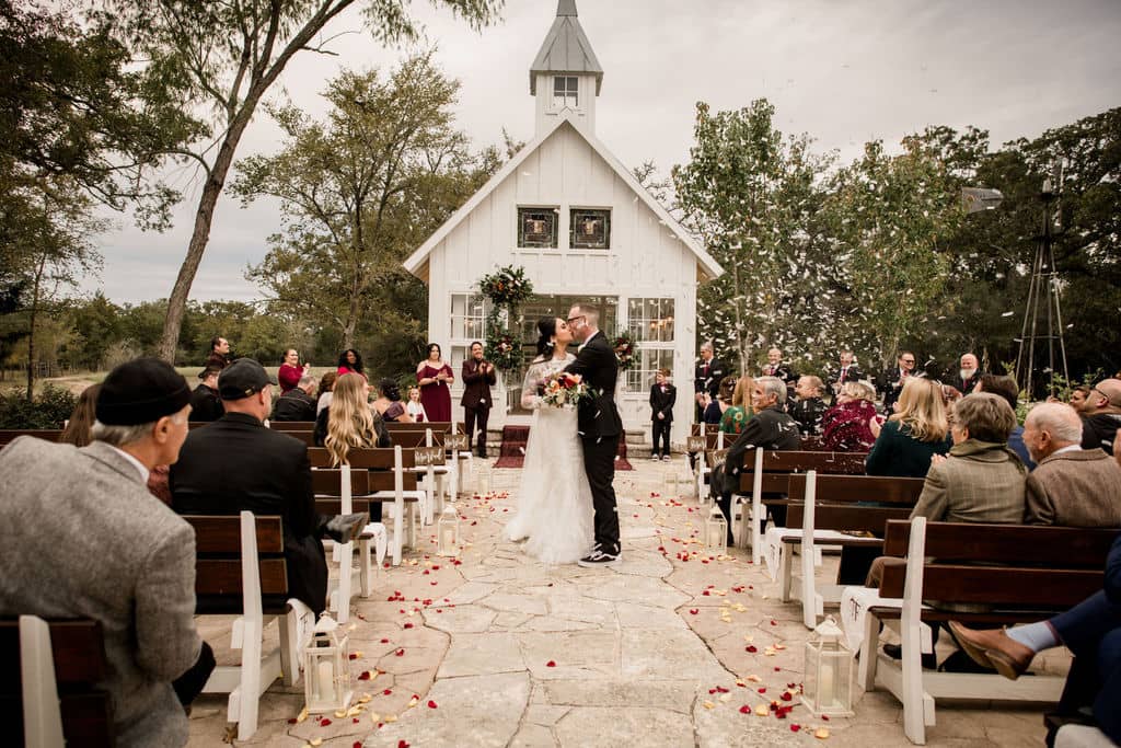 A unique wedding exit at 7F Lodge in Texas surrounded by confetti captured by Jamie Hardin Photography
