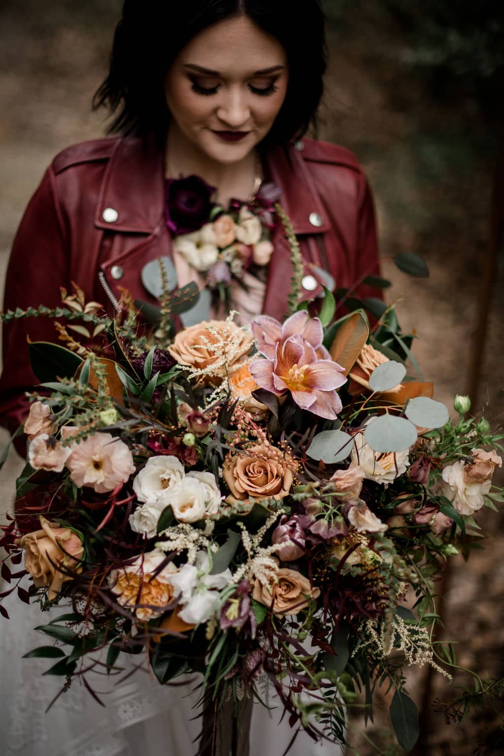 the texas bride is holding an intricate bridal bouquet done by a texas wedding florist