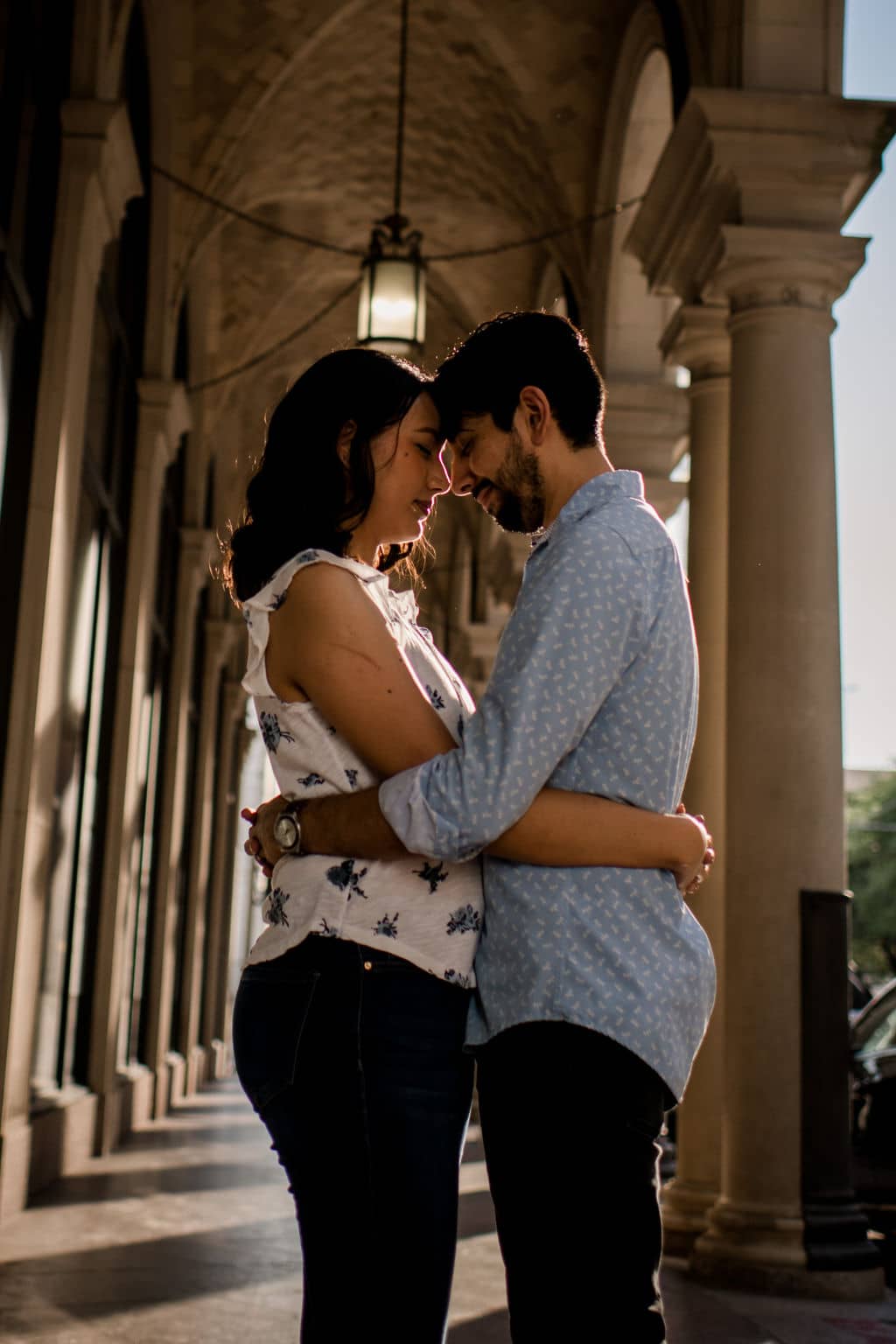 the future bride and groom changed their engagement photo outfits while holding each other