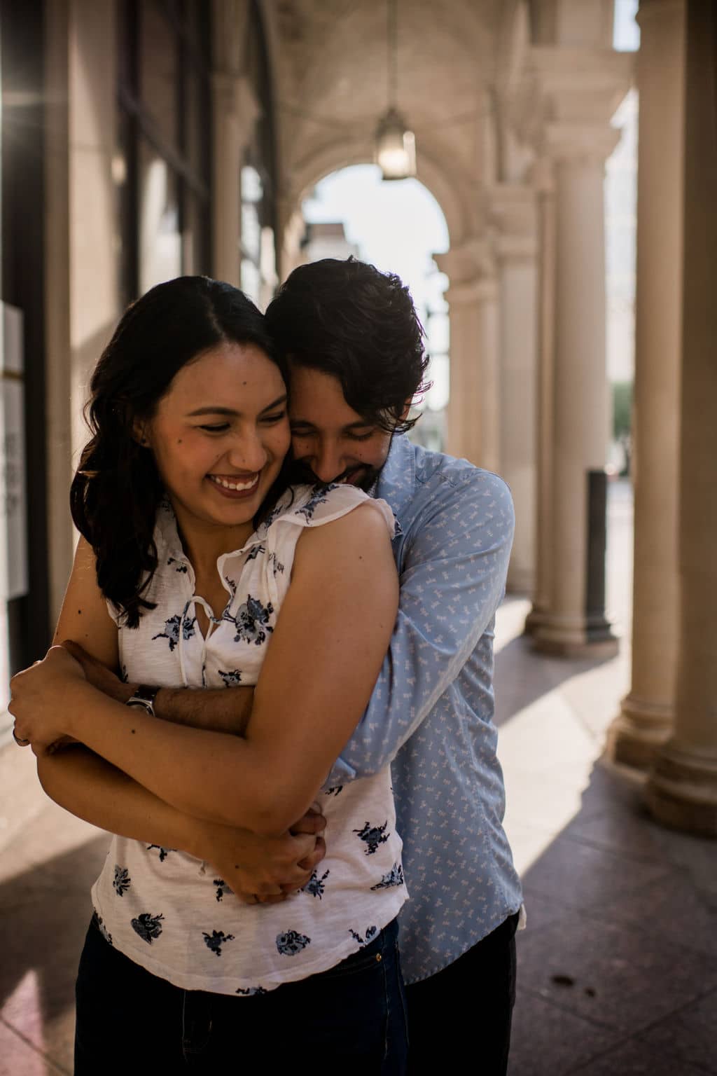 the future groom is embracing his future bride in texas