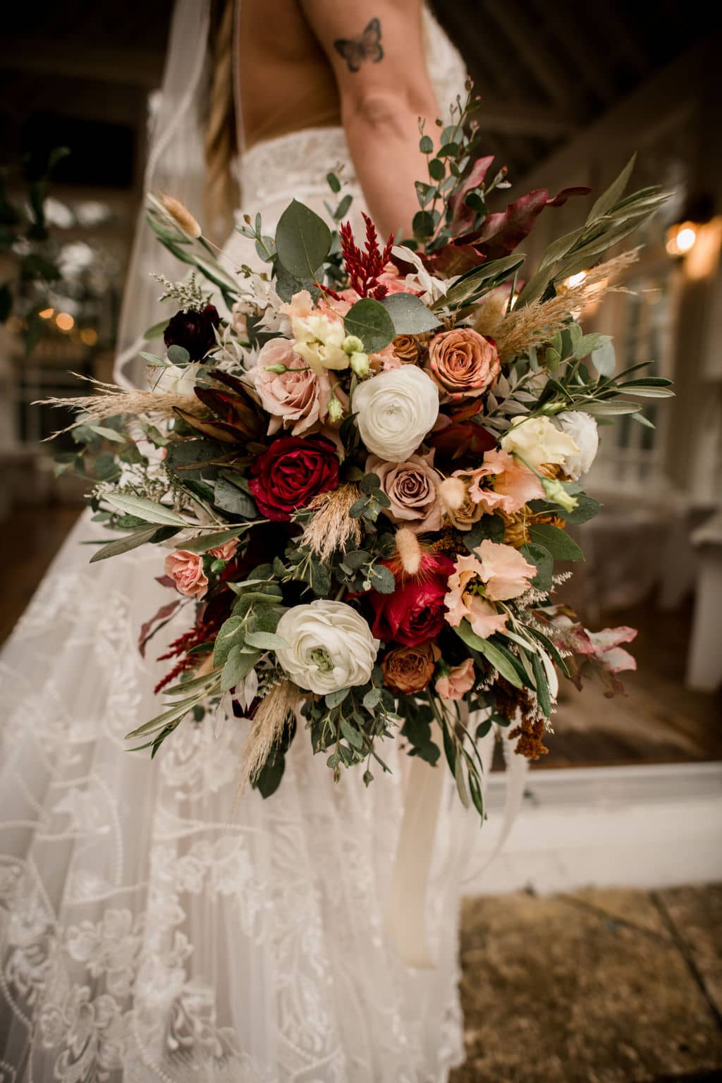 the texas bride is holding an intricate bridal bouquet done by a texas wedding florist