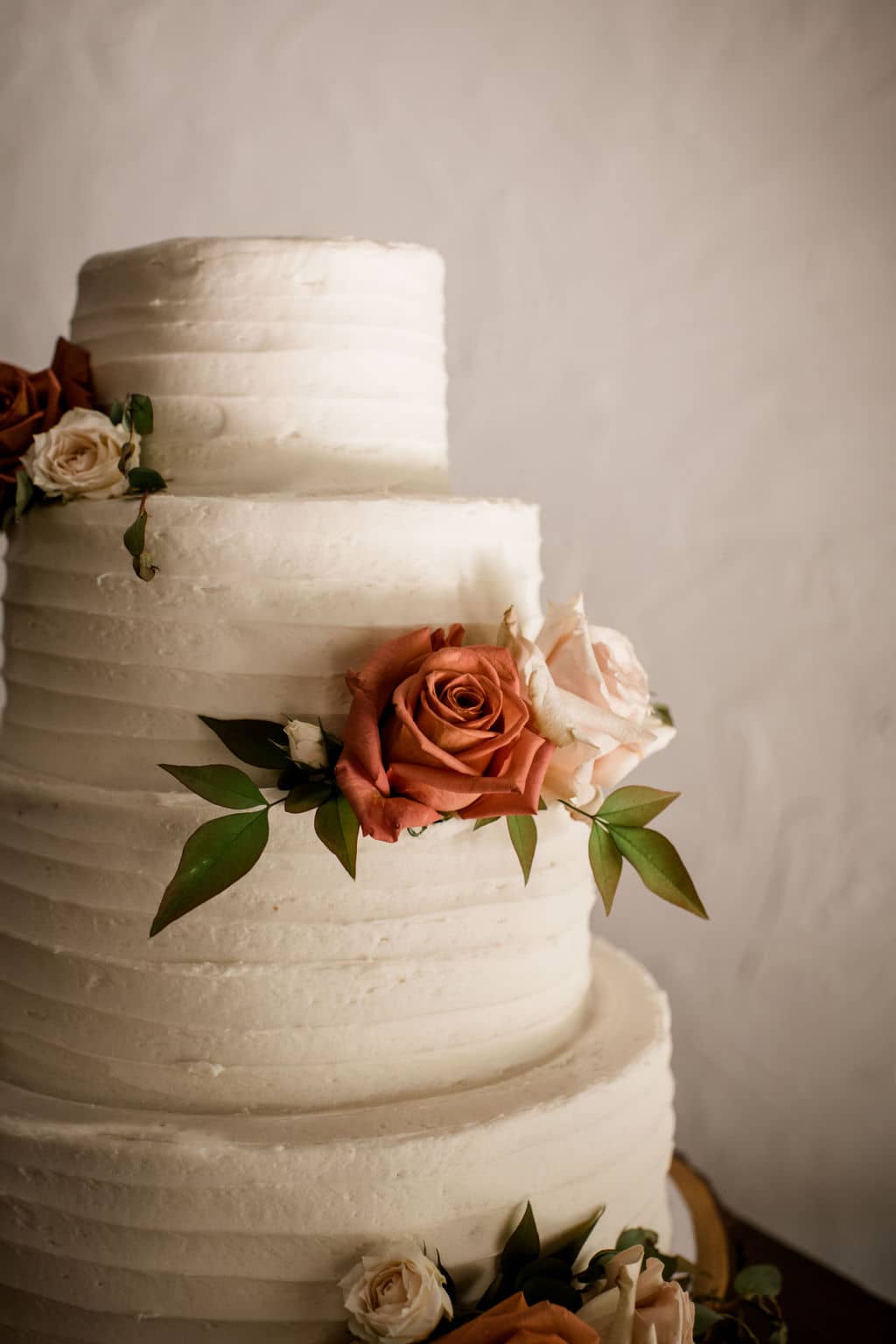 in learning how to plan a wedding in bryan college station, the bride and groom opted for a four tier cake form a local vendor