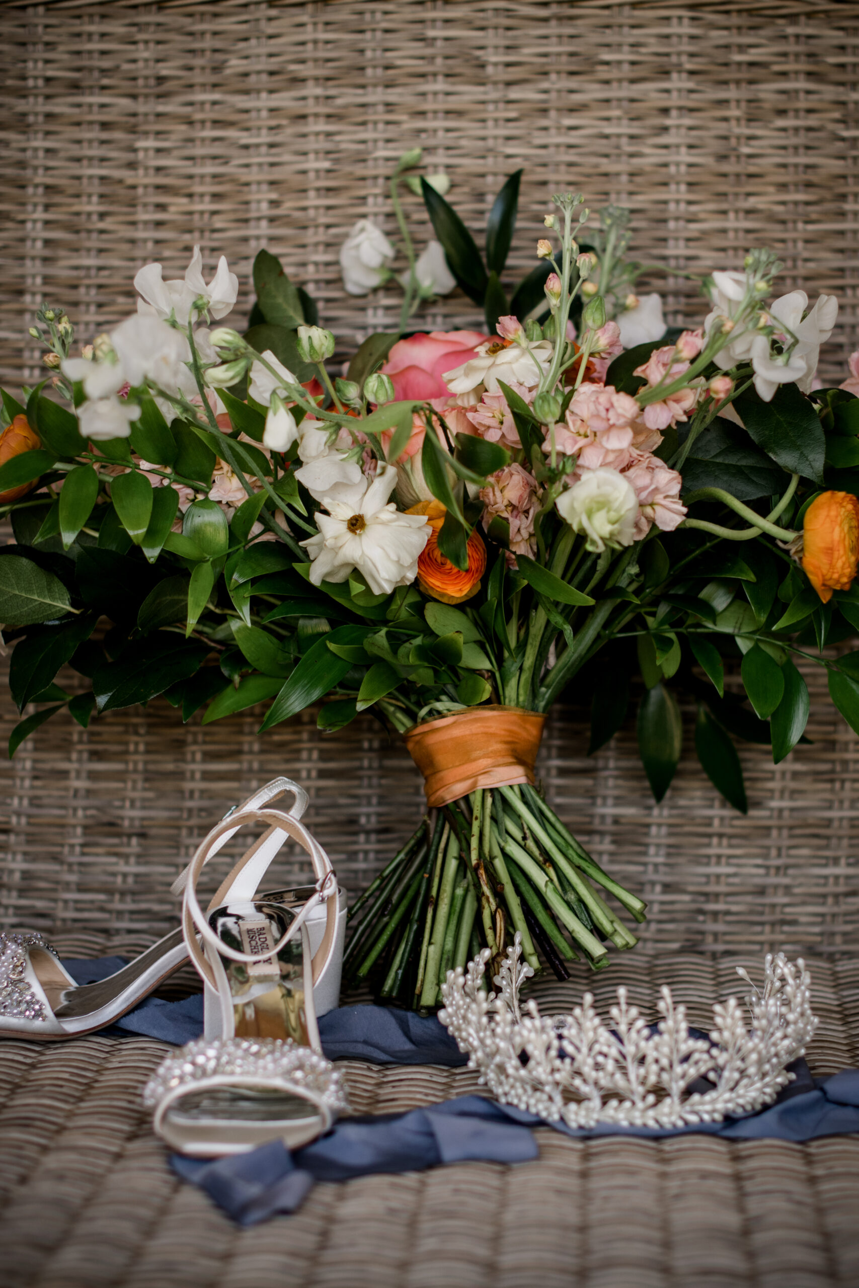 the bride's texas summer wedding seasonal bride bouquet, crown, and heels are posed for details