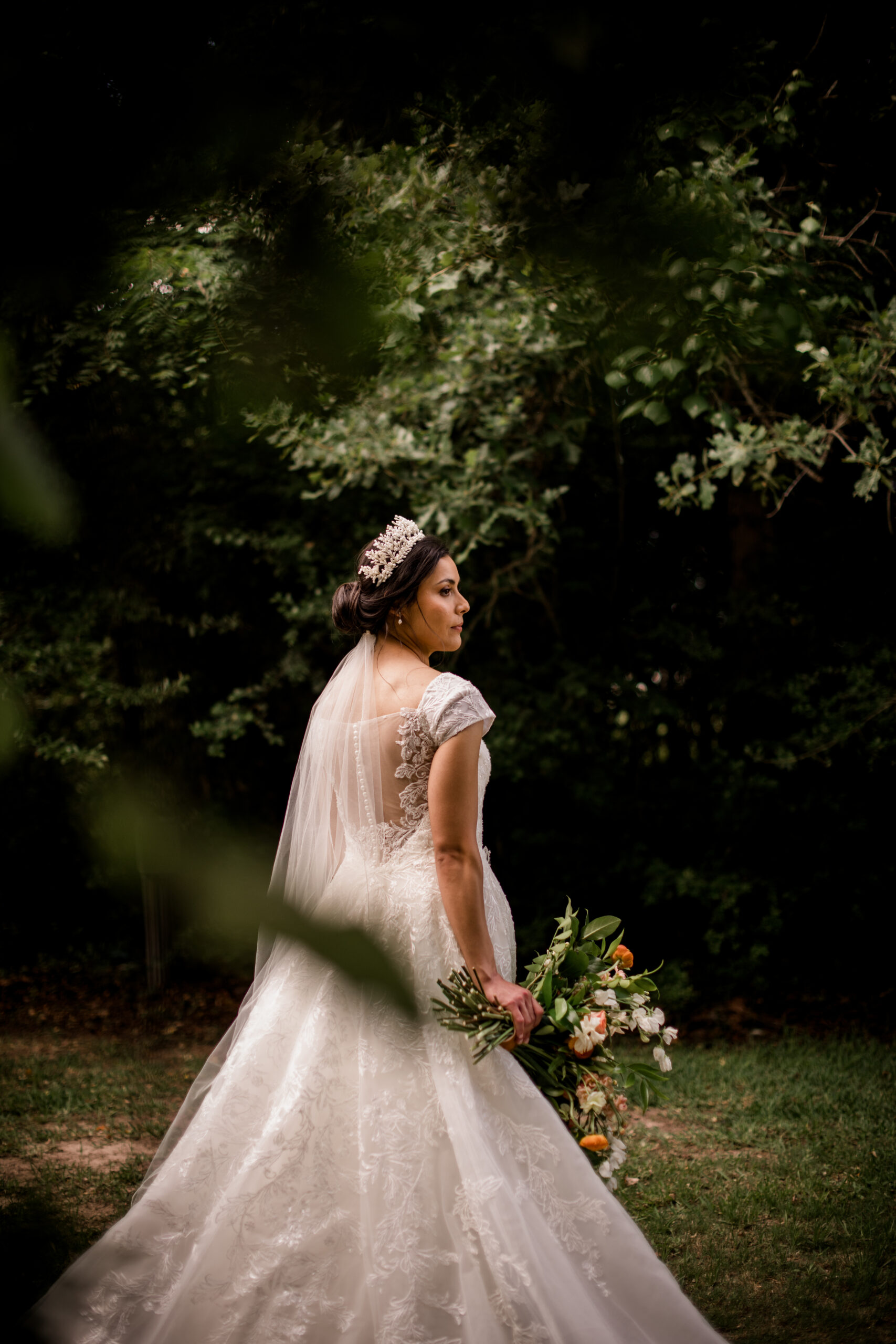 the texas bride is under the sun holding her bridal bouquet