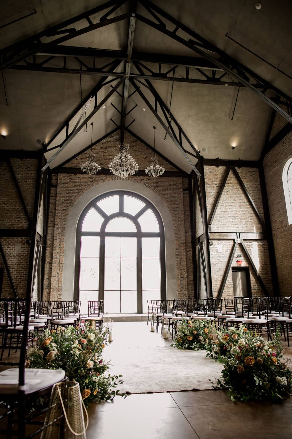 the entire texas church with a huge curved glass window is surrounded by floral designs made from urban rubbish