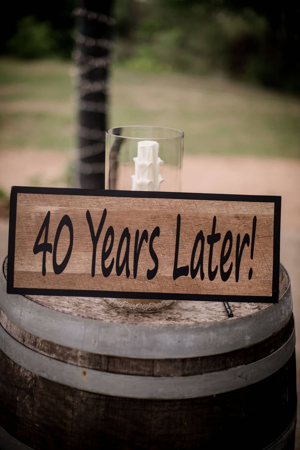 a sign depicting "40 years later!" for the couple's vow renewal