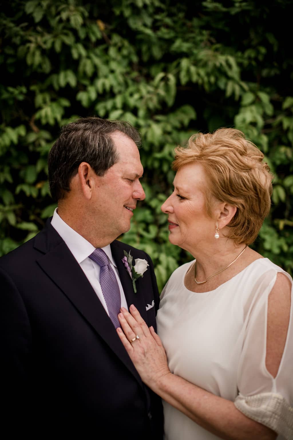 the bride and groom look into each other's eyes on their vow renewal day.