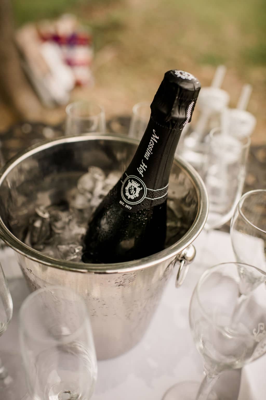 a bottle of champagne in a bucket of ice for the celebration
