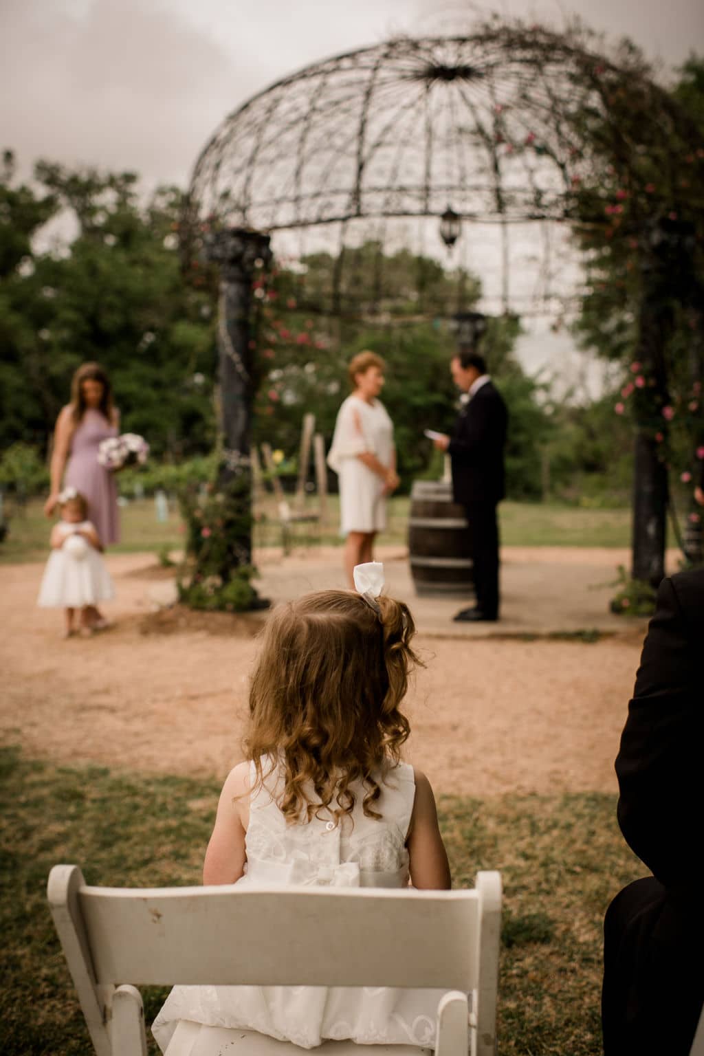 a wide angle of the entire vow renewal ceremony where their grand daughter is watching