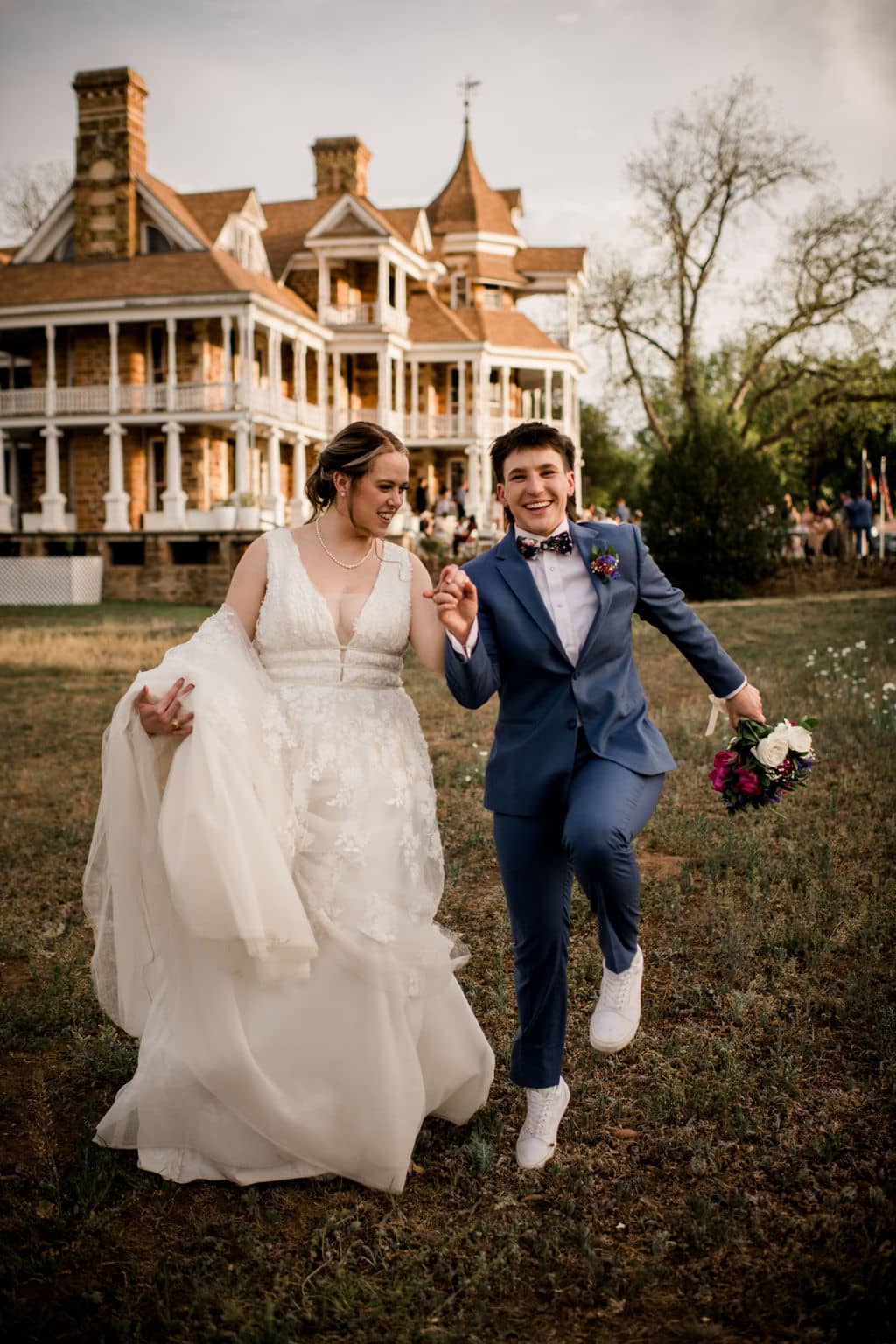 the texas brides walking away from their venue as they jump in the air captured using a photographer must haves tool